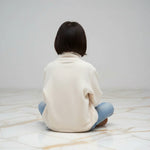 Back view sitting cross-legged