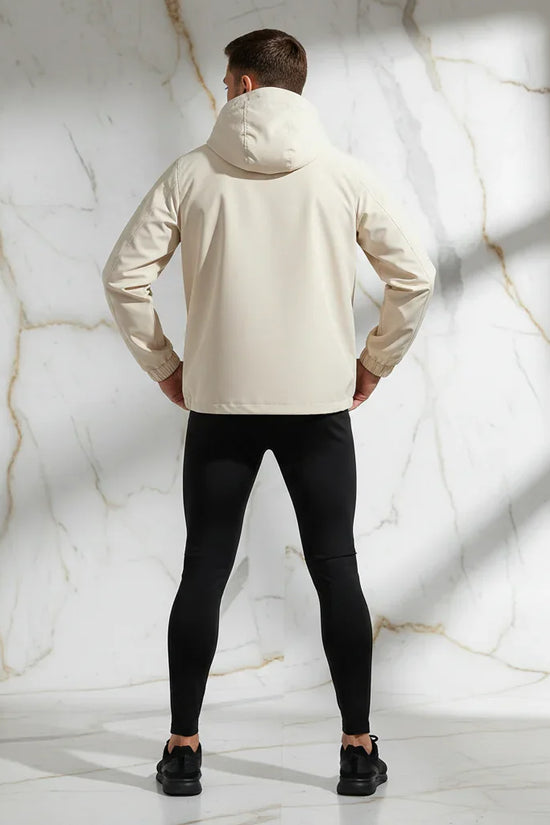 Back view - sporty man in off-white jacket