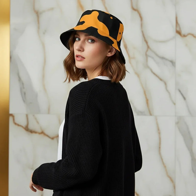 Woman in black sweater and orange-black bucket hat, stylish apparel by Ivorynn