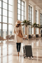 Back view - Woman walking away, luggage closed