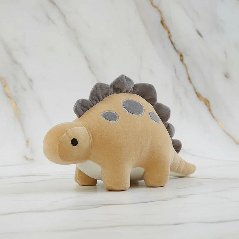 Beige dinosaur on marble