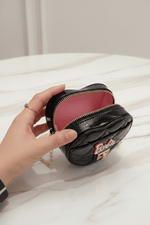 Black bag opened by hand