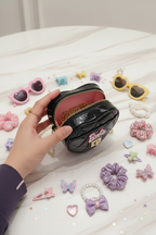 Black bag opened with kids accessories