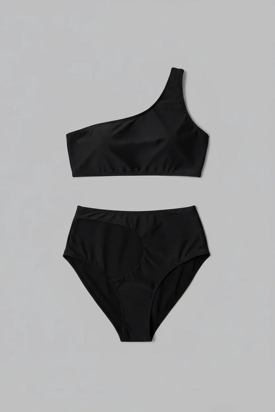 Black swimsuit flat lay