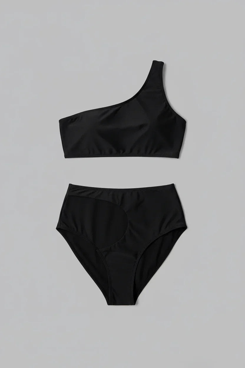 Black swimsuit flat lay