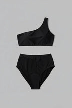 Black swimsuit flat lay