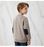 Boy back view with head turned