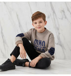 Boy wearing sweater - seated pose