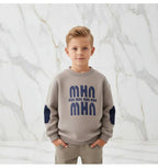 Boy with hands in pockets