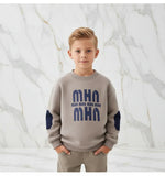 Boy with hands in pockets