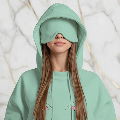 Close-up detail of cat embroidery and eye mask