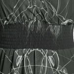 Close-up of elastic waistband on printed fabric skirt, stylish women's fashion at Ivorynn
