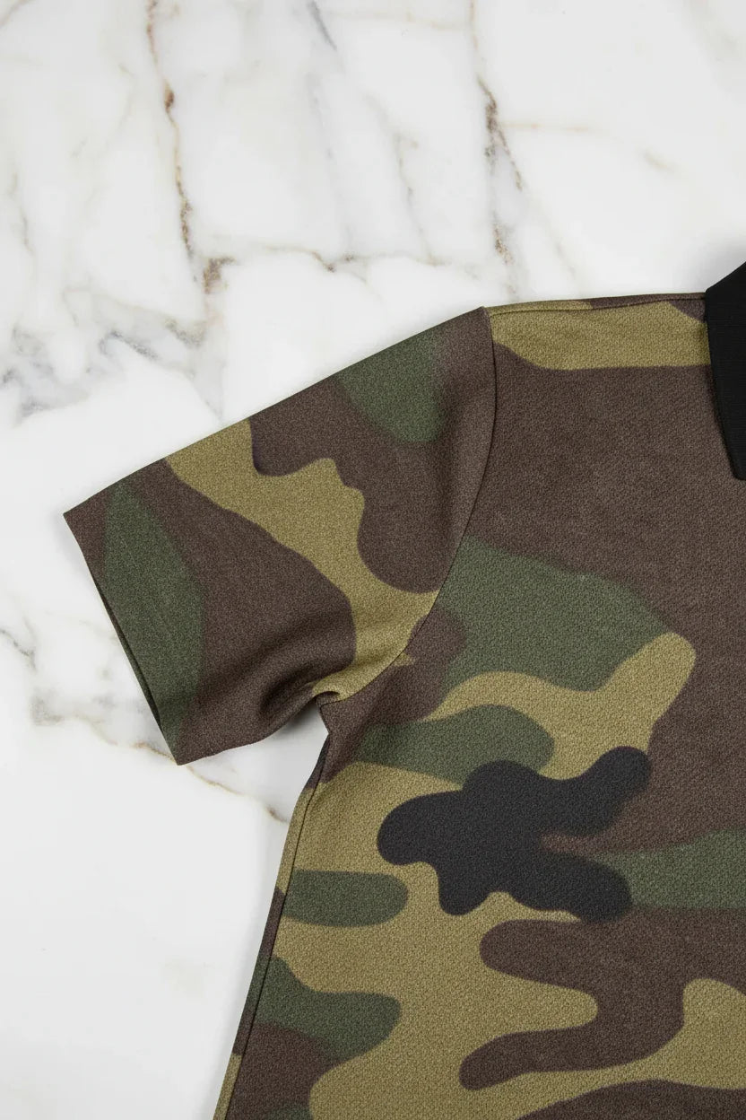 Close-up of camo fabric short sleeve shirt on white marble surface, Ivorynn fashion