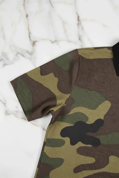 Close-up of camo fabric short sleeve shirt on white marble surface, Ivorynn fashion