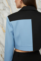 Close-up of back shoulder and cropped hemline