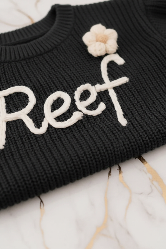 Close-up of embroidered text detail