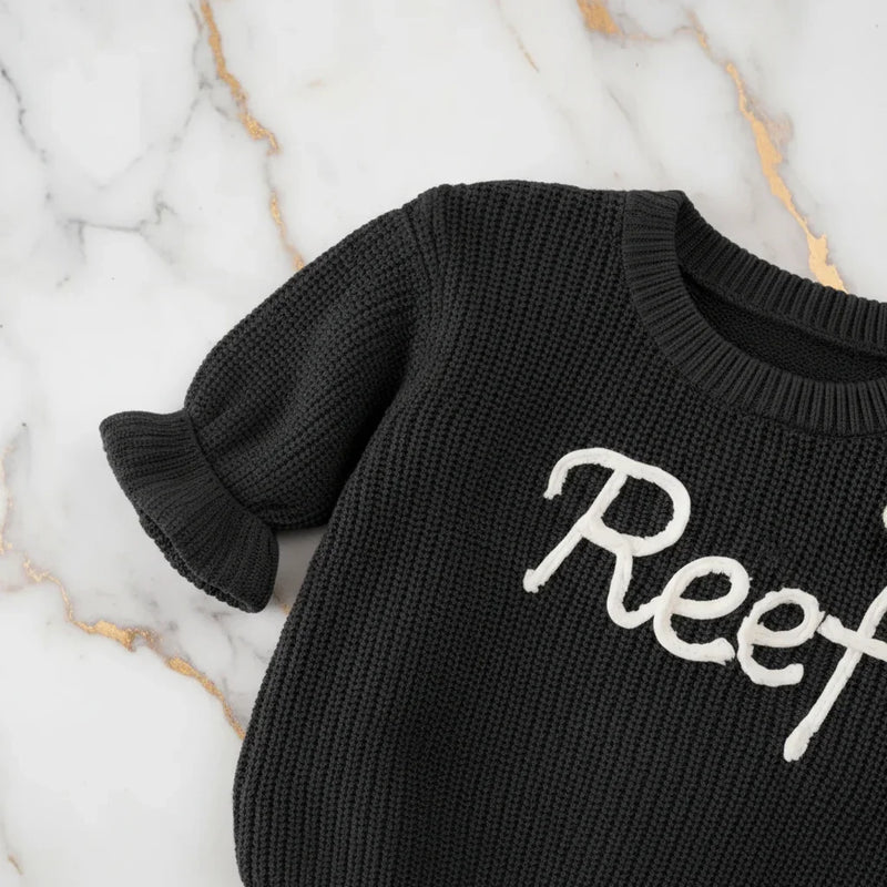 Close-up of knitted texture and sleeves