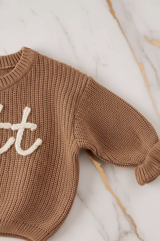 Close-up of knitted texture and sleeves