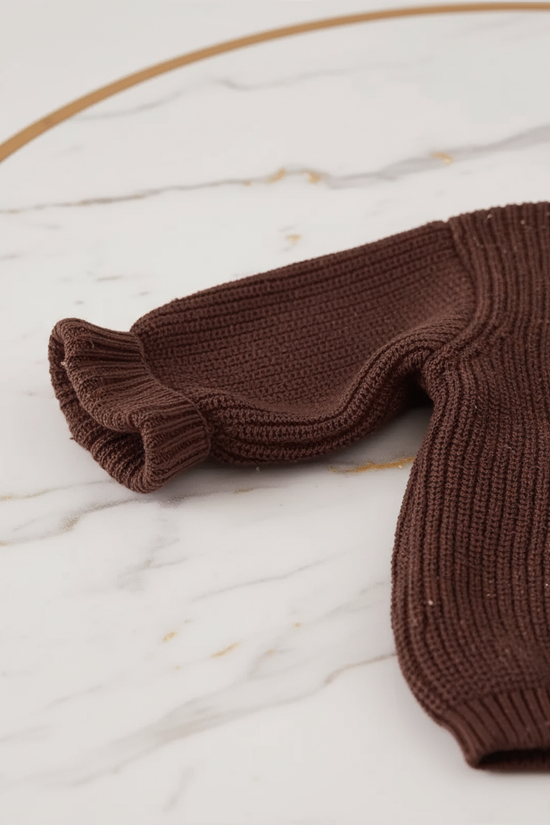 Close-up of ruffled sleeves