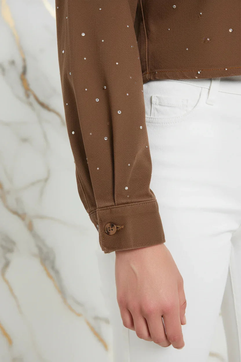 Close-up of sleeve cuff with button detail