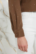 Close-up of sleeve cuff with button detail