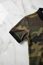 Close-up of a short sleeve camo shirt with black cuff on marble surface, Ivorynn fashion