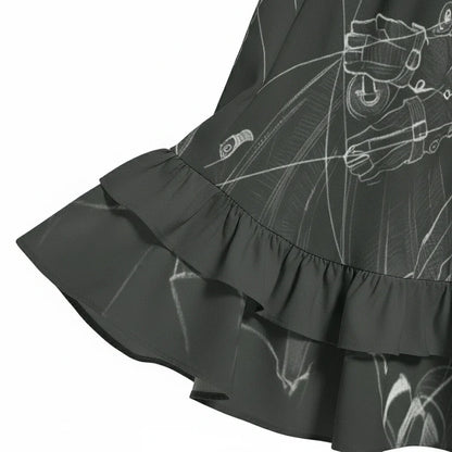 Close-up of a dark ruffled sleeve cuff with white outline print, stylish women's fashion at Ivorynn