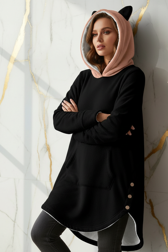 Confident casual pose against marble wall