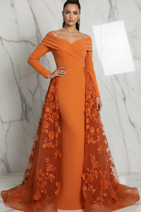 Confident pose with hand on hip - Orange gown