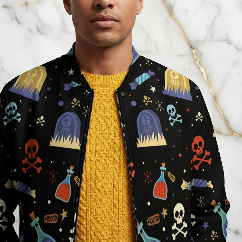 Man wearing black bomber jacket with colorful Halloween skull, tombstone, and potion bottle print
