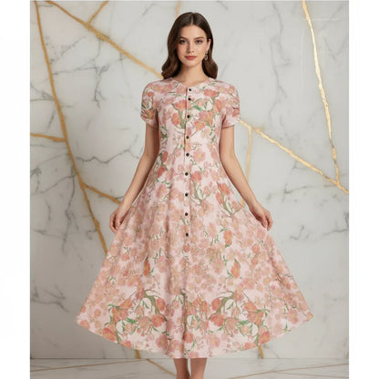Woman modeling a floral pink button-down dress, stylish apparel from Ivorynn, marble background