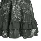 Black ruffle hem skirt with white graphic line art, stylish women's fashion at Ivorynn