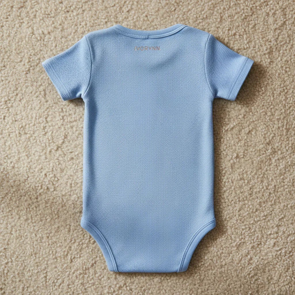 Detailed close-up of back fabric and IVORYNN text on beige carpet