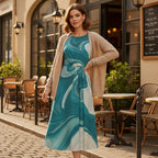 Woman modeling stylish teal dress and cardigan outside European cafe, Ivorynn fashion
