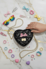 Flat lay black bag top view with kids accessories