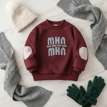 Fleece sweater on cream marble with cozy accessories