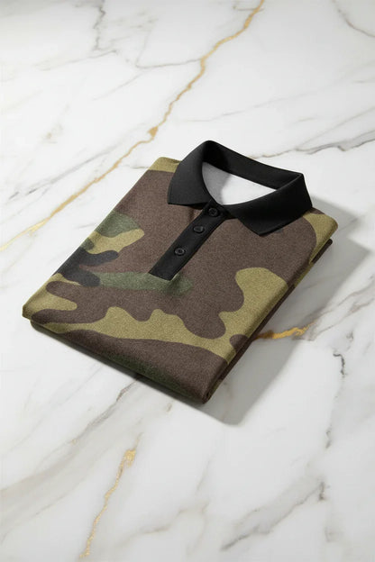 Folded camo polo shirt with black collar on marble surface, stylish men's apparel at Ivorynn