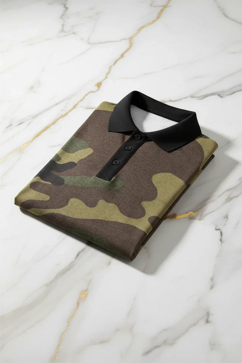Folded camo polo shirt with black collar on marble surface, stylish men's apparel at Ivorynn