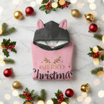 Folded hoodie with ornaments, holly, and twinkling lights