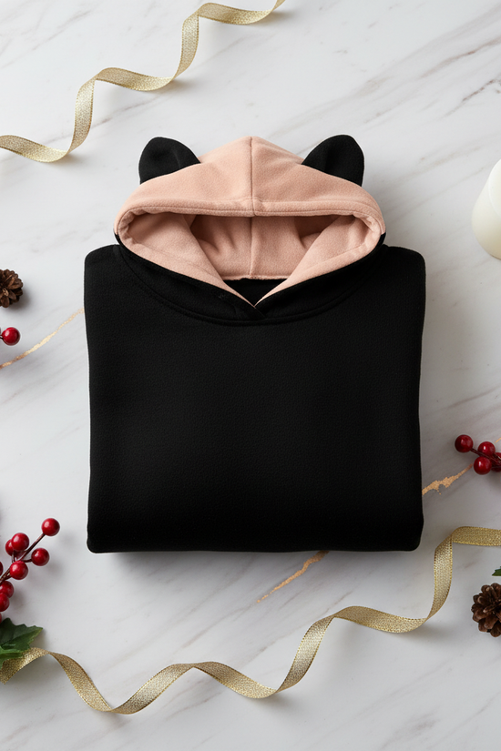 Folded hoodie with red berries and gold accents