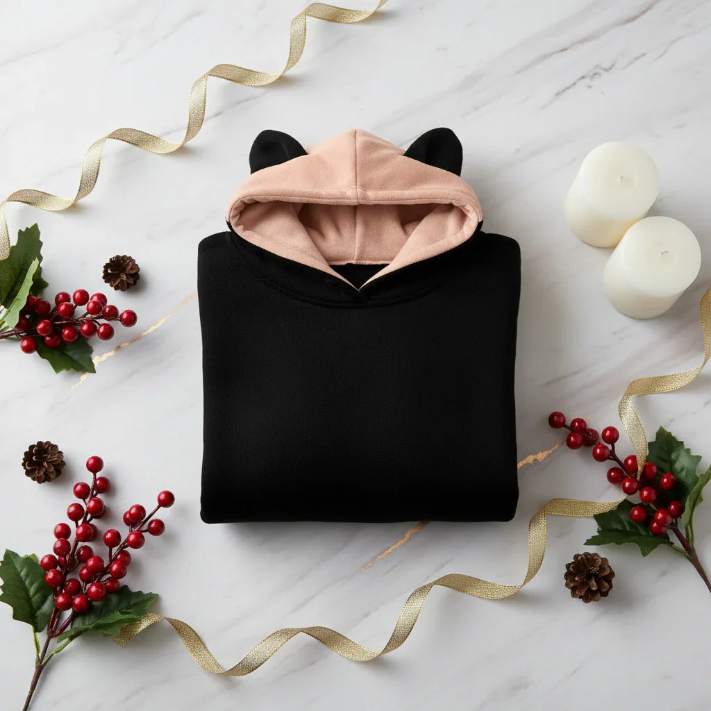 Folded hoodie with red berries and gold accents