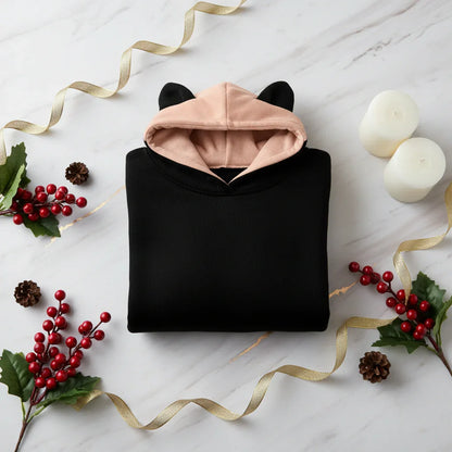 Folded hoodie with red berries and gold accents