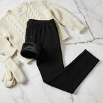 Folded with fleece showing, styled with sweater and mittens