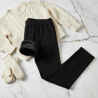 Folded with fleece showing, styled with sweater and mittens