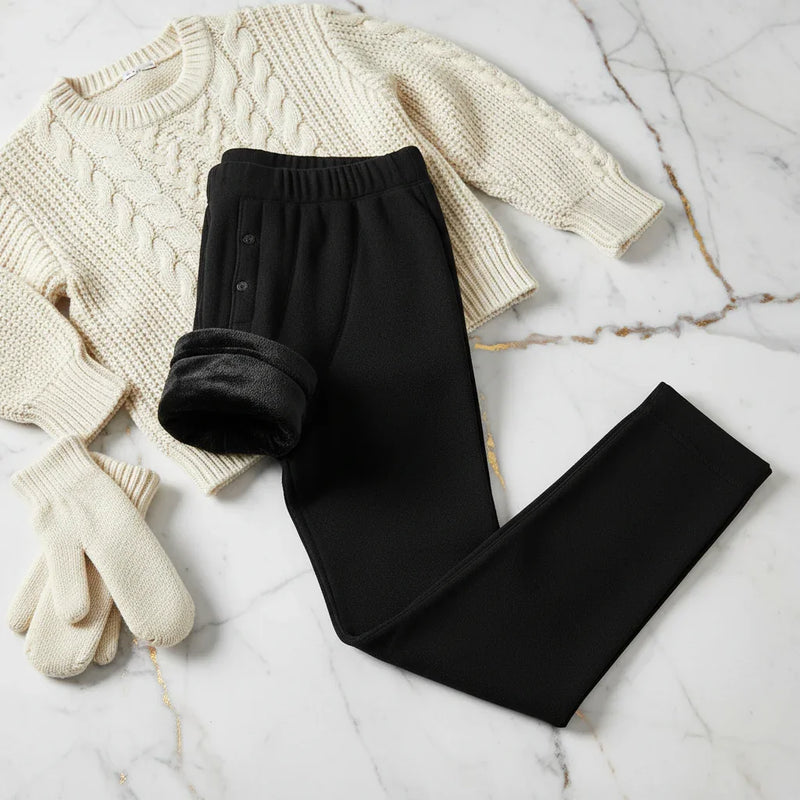 Folded with fleece showing, styled with sweater and mittens