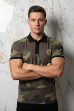 Man wearing camo print polo shirt with arms crossed, stylish men's fashion at Ivorynn