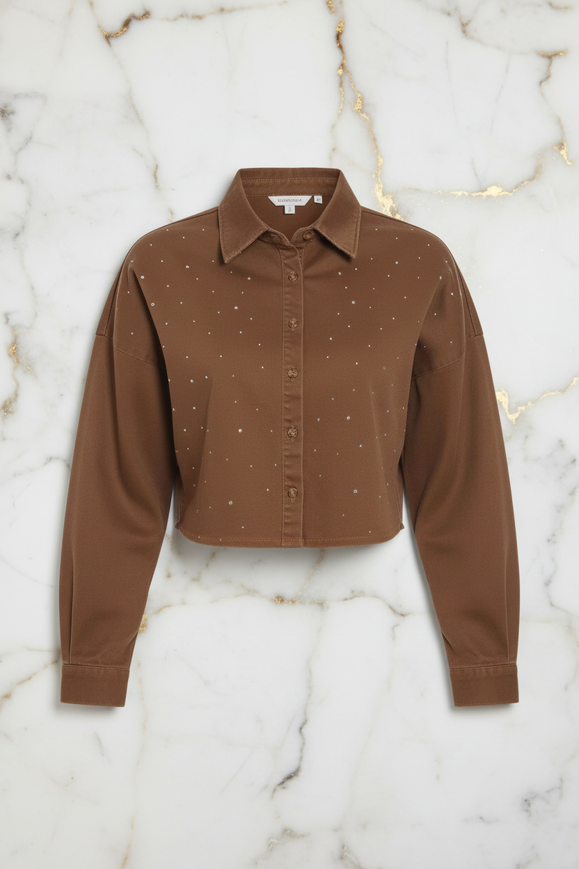Front view of brown denim shirt on marble background