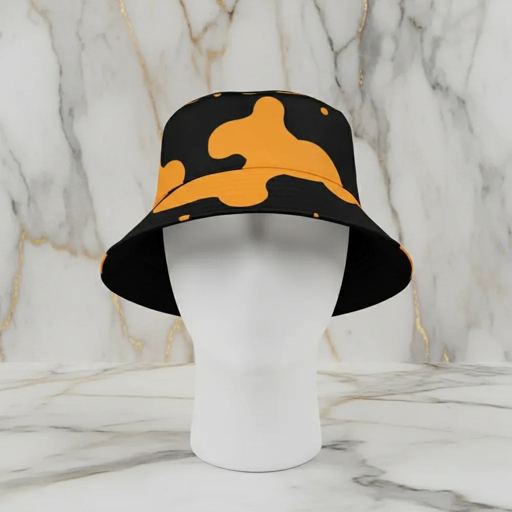 Black and yellow camo bucket hat on a mannequin, luxury accessory at Ivorynn