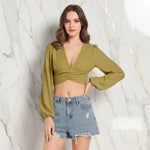 Front view with hand on hip in denim shorts