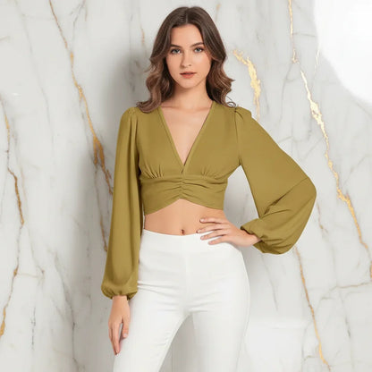 Front view with hand on hip in white pants